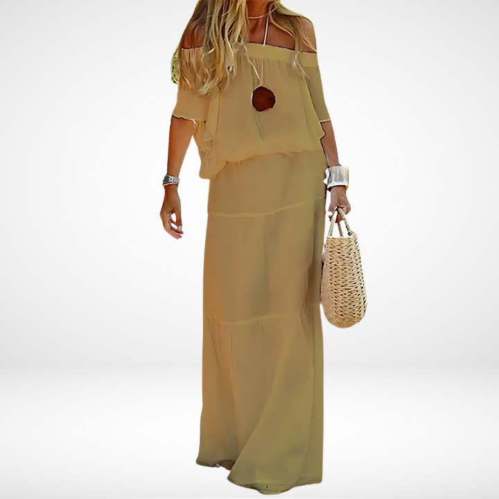 Elegantes weißes schulterfreies Maxikleid für den Strand