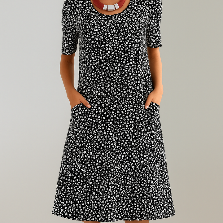 Blumiges Midikleid mit hoher Taille und Taschen